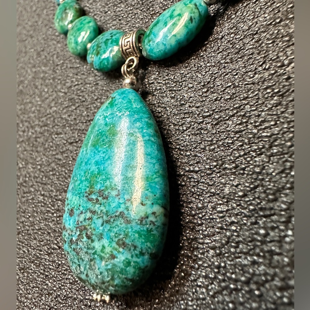 Vintage Stauer necklace with teal stones.